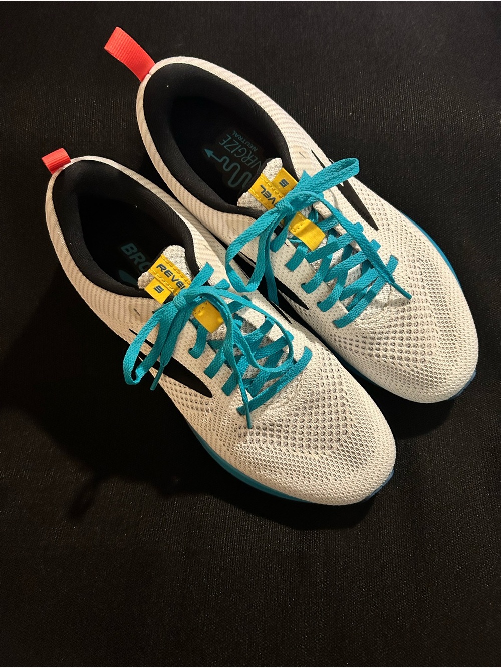 Brooks women’s White Running Shoes with Teal Laces size 9